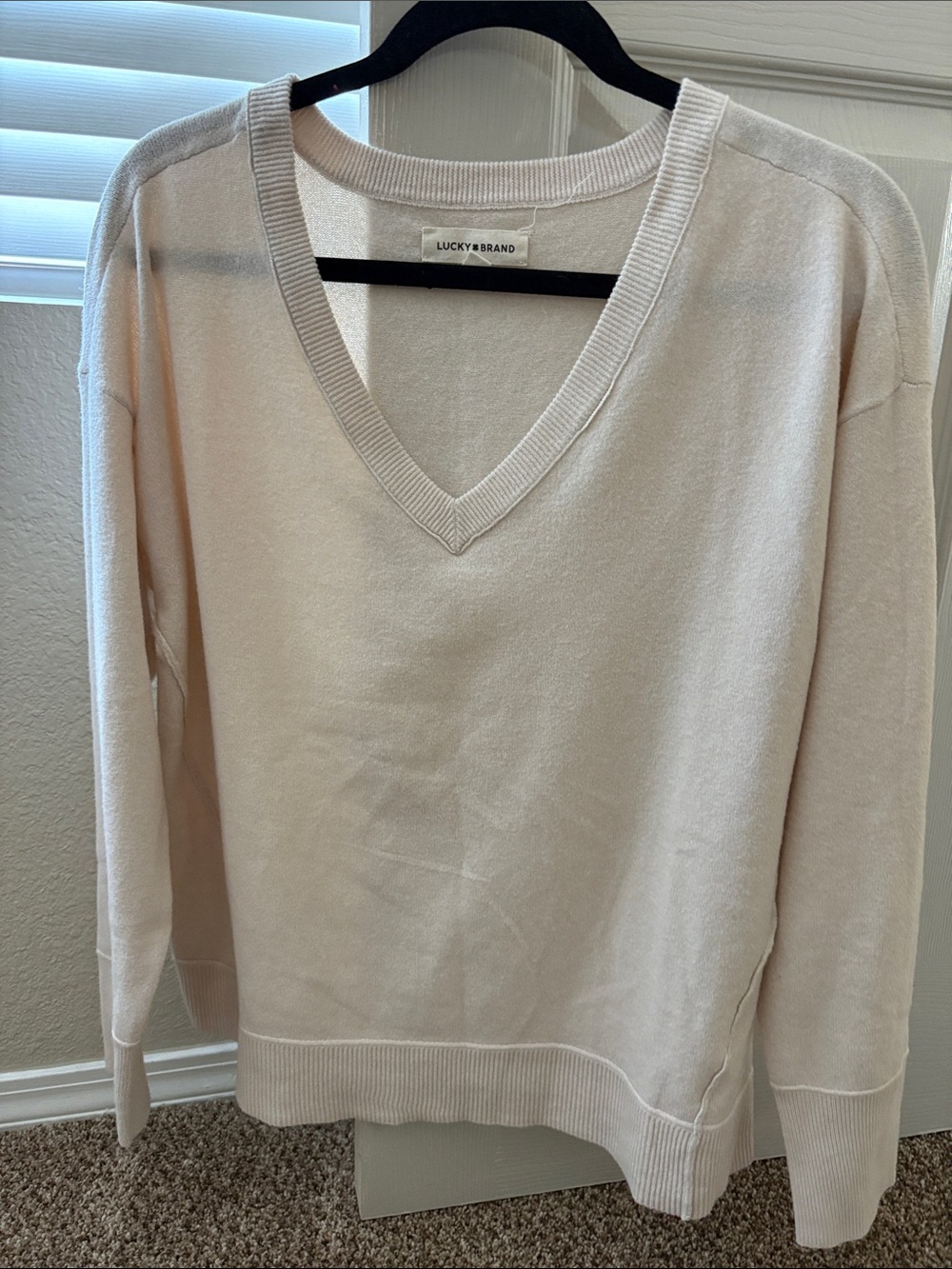 Lucky Brand Women's V-Neck Sweater in cream.